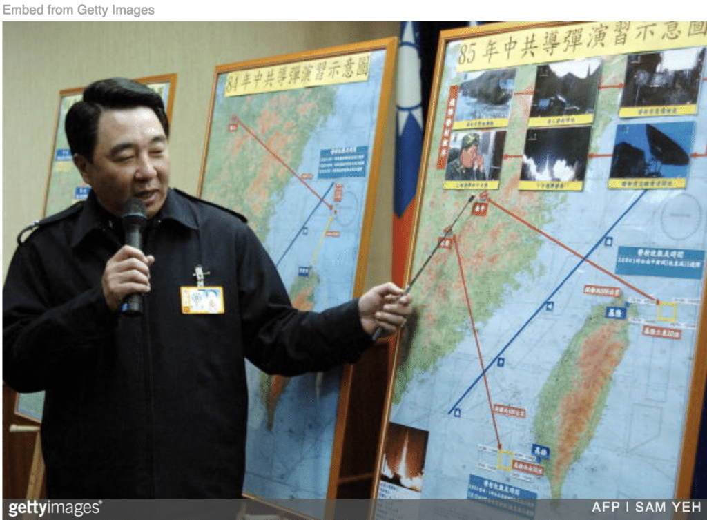 Taiwan defense minister show map of Taiwan Strait to illustrate danger China pose.