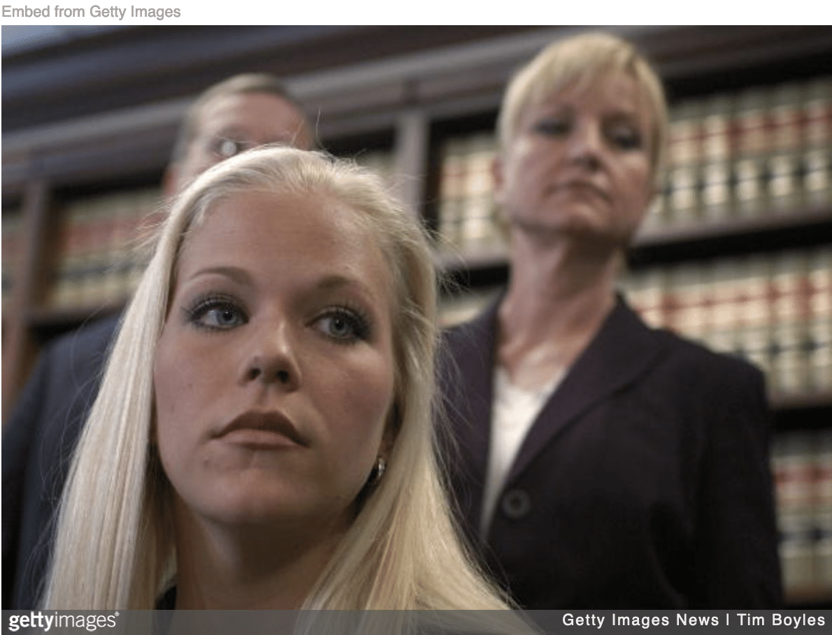 Debra Lafave with her lawyers after being charged for having sex with her student.