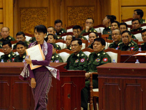 Aung San Suu Kyi walks to her oath at the lower house of parliament Burma