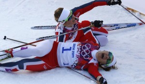 Winner Falla of Norway and her team mate, second placed Oestberg celebrate after competing in the women's cross-country sprint free final at the Sochi 2014 Winter Olympic Games in Rosa Khutor