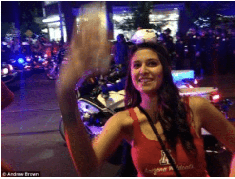 taking selfies while police are quelling riots