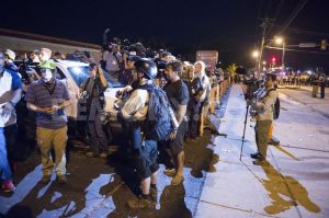 1408535931-media-circus-in-ferguson-after-peaceful-day-turns-into-chaos-missouri_5562423