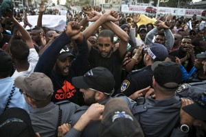 Protesters, mainly whom are Israeli Jews of Ethiopian origin, shout slogans during a demonstration against what they say is police racism and brutality