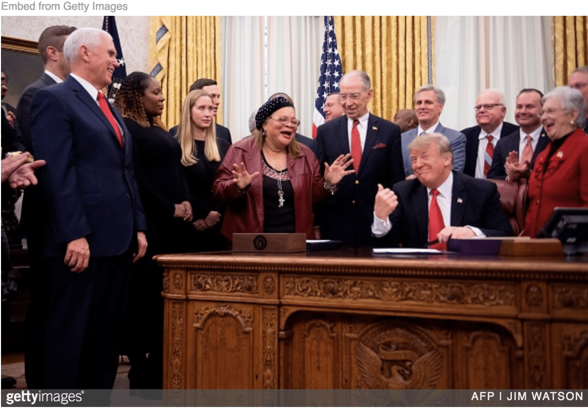 Trump signing First Step Act criminal justice reform in the Oval Office.