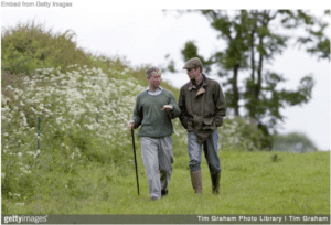 Prince Charles and Prince William walking in garden