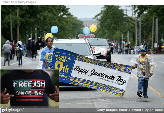 Blacks marching in Juneteenth parade with Black wearing T-shirt with "free.ish" on front.
