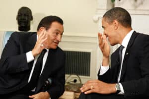 Egyptian President Hosni Mubarak and President Obama sitting and laughing at White House