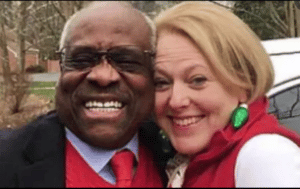 Justice Thomas laughing with his wife