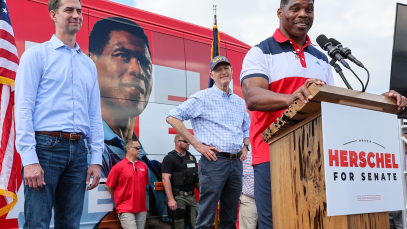 Hershel Walker with Tom Cotton and Rick Scott campaigning