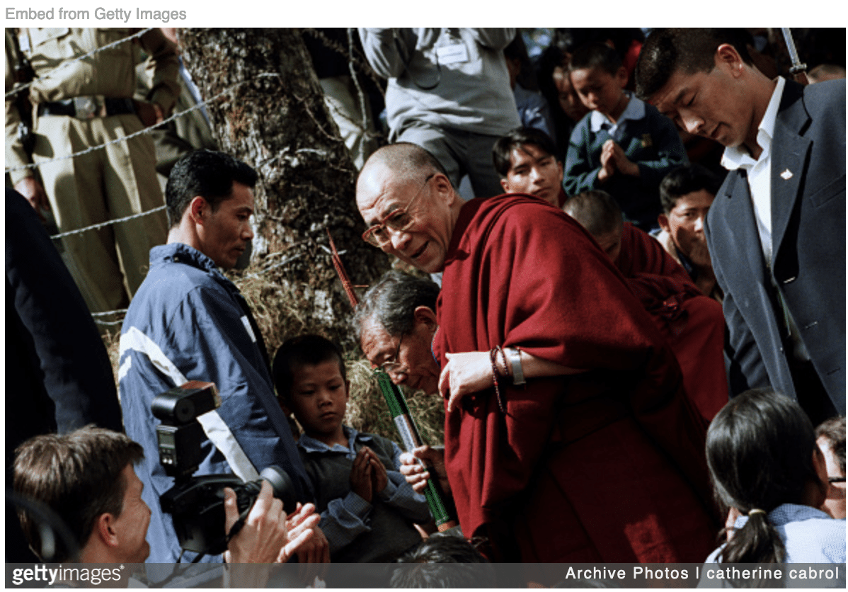 Dalai Lama asking boy to suck his tongue