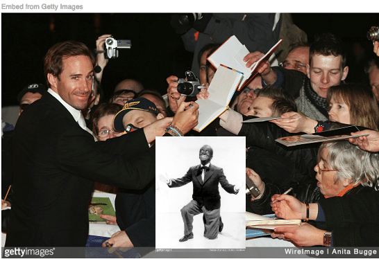 Joseph Fiennes signing autographs with image of minstrel singer inset.