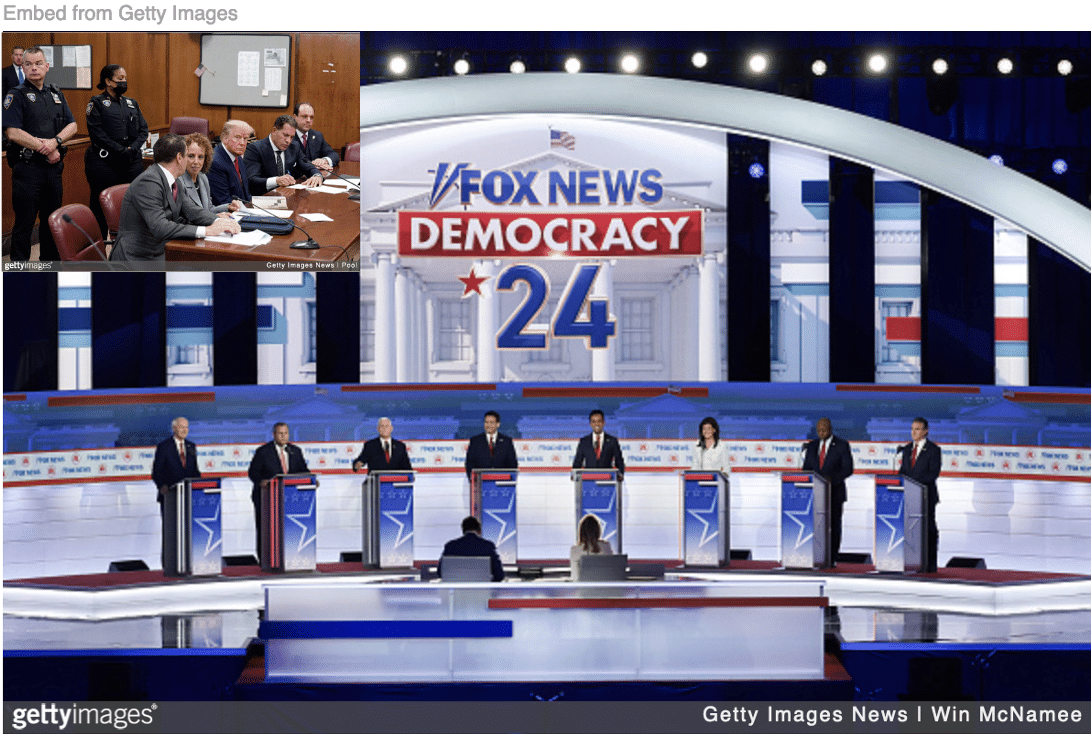All candidates on stage for first 2023 Republican presidential debate with Trump at defense table during his first of four arrests.